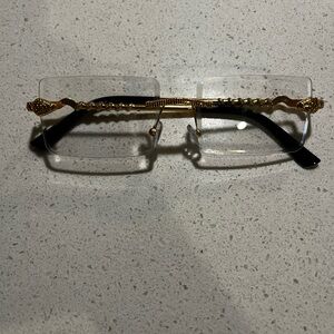 Gold and Black Rimless Glasses